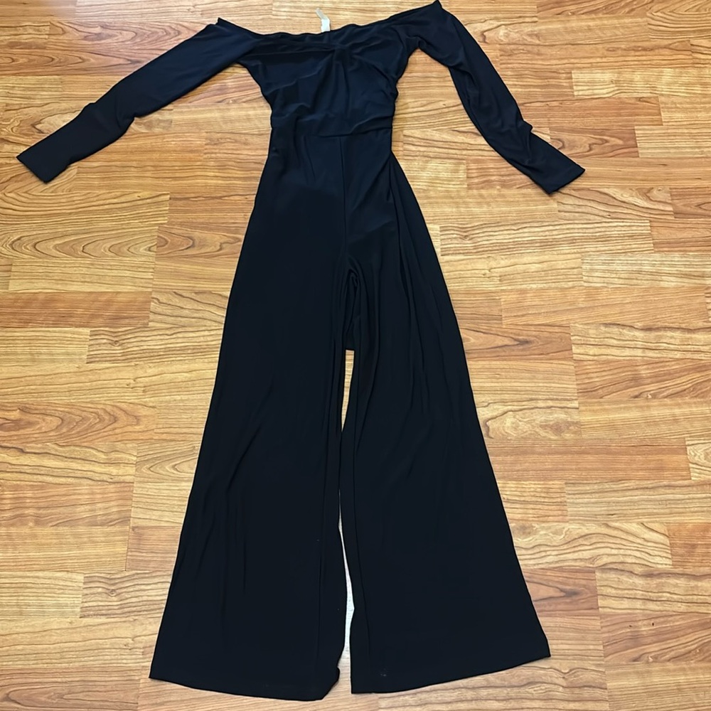 Hello Miss 3/4 sleeve black capri pant jumpsuit. Wrap around waist. Size small.